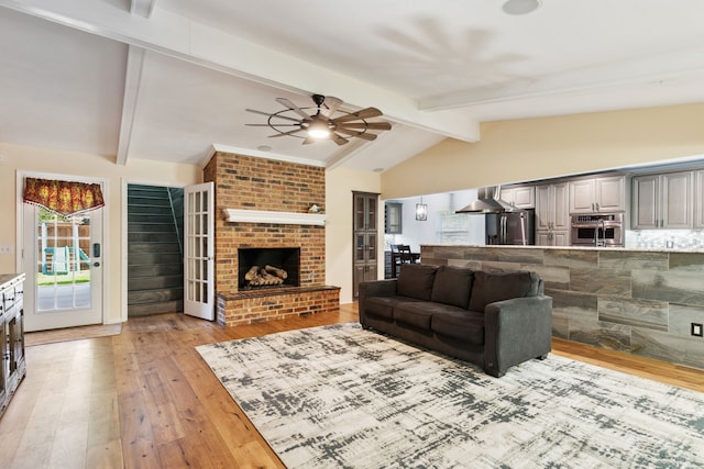 3100 Jomar Dr, Plano, TX 75075 - living area featuring a ceiling fan, light wood-style flooring, and a fireplace