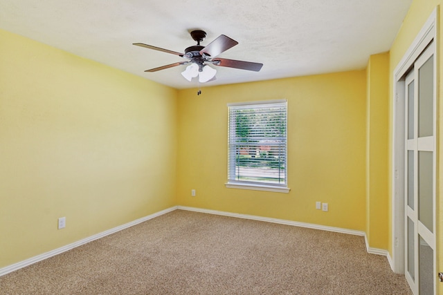 3100 Jomar Dr, Plano, TX 75075 - empty room featuring carpet flooring, ceiling fan, and baseboards