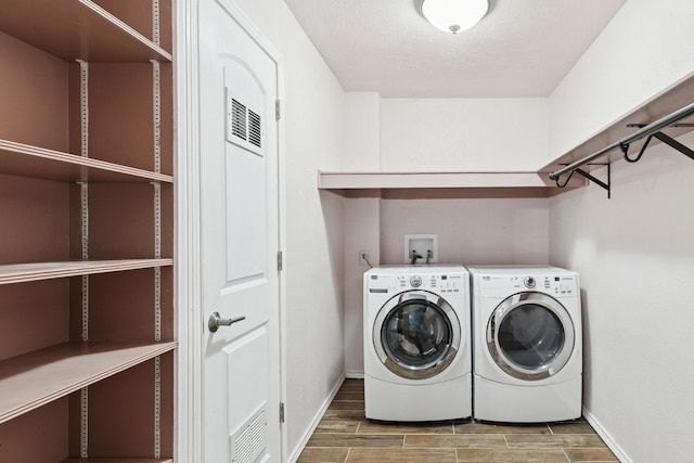 3100 Jomar Dr, Plano, TX 75075 - washroom featuring baseboards, independent washer and dryer, and wood finished floors