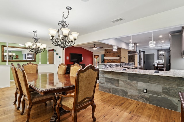 3100 Jomar Dr, Plano, TX 75075 - dining space featuring a chandelier, light wood-type flooring, a ceiling fan, and vaulted ceiling