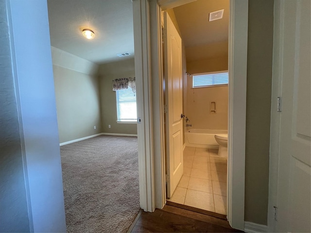 4669 Lucient Cir, Plano, TX 75024 - corridor with dark carpet, baseboards, and dark tile patterned floors