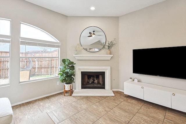 1689 Big Bend Dr, Lewisville, TX 75077 - unfurnished living room with a fireplace with raised hearth, baseboards, recessed lighting, and a ceiling fan
