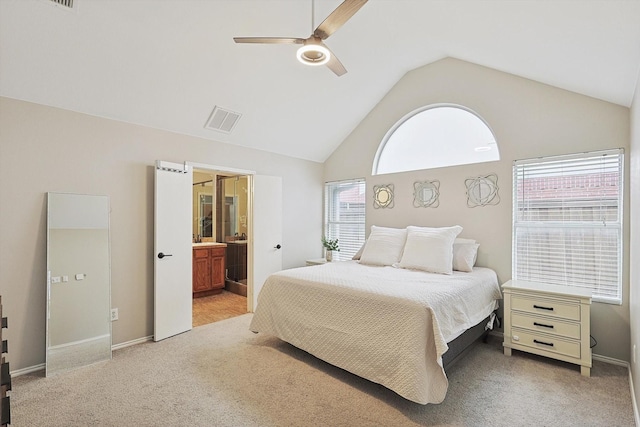 1689 Big Bend Dr, Lewisville, TX 75077 - bedroom with light carpet, multiple windows, ensuite bathroom, and high vaulted ceiling