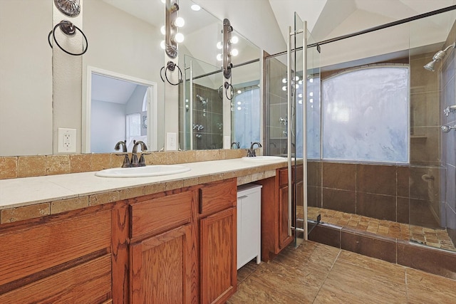 1689 Big Bend Dr, Lewisville, TX 75077 - bathroom featuring a shower stall, double vanity, and lofted ceiling