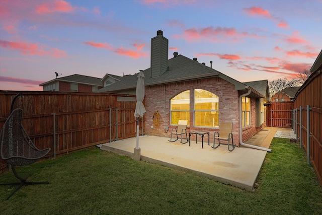 1689 Big Bend Dr, Lewisville, TX 75077 - rear view of house with a chimney, a patio, brick siding, and roof with shingles