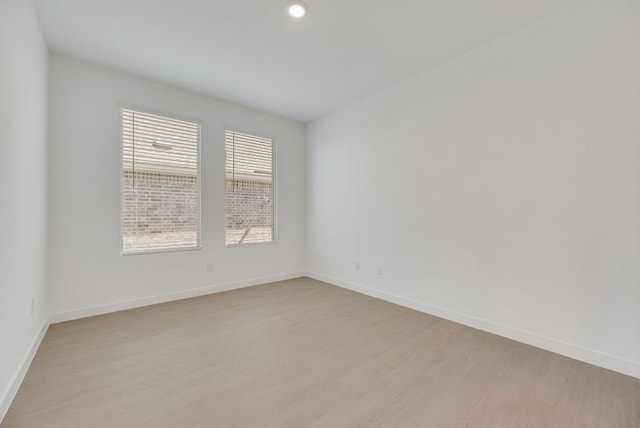 1301 Francesca Dr, Little Elm, TX 75068 - unfurnished room featuring light wood finished floors, baseboards, and recessed lighting