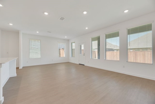 1301 Francesca Dr, Little Elm, TX 75068 - spare room featuring light wood-style flooring, recessed lighting, and baseboards