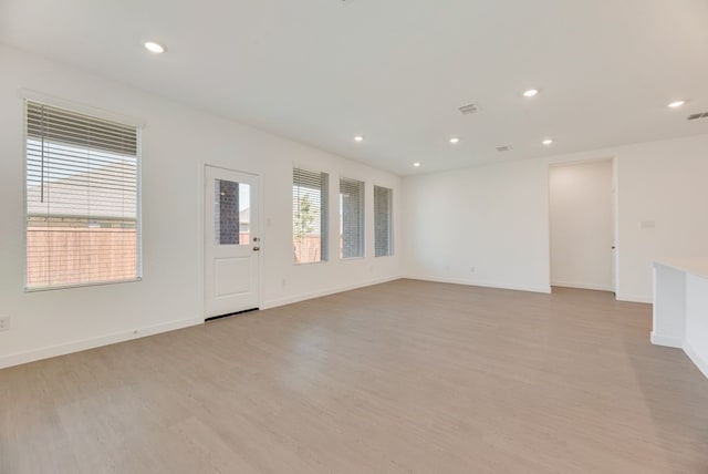 1301 Francesca Dr, Little Elm, TX 75068 - unfurnished room with light wood-type flooring, recessed lighting, and baseboards