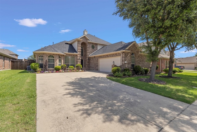 1713 Westfield Way, Allen, TX 75002 - view of front of property with a garage, driveway, a chimney, and brick siding