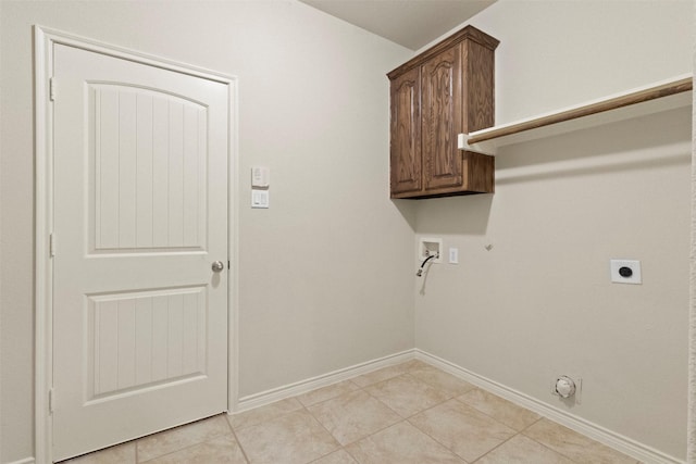 1713 Westfield Way, Allen, TX 75002 - laundry area with gas dryer hookup, washer hookup, hookup for an electric dryer, cabinet space, and light tile patterned floors