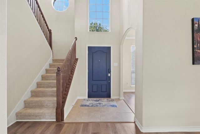 1713 Westfield Way, Allen, TX 75002 - entryway with a high ceiling, arched walkways, stairs, and wood finished floors