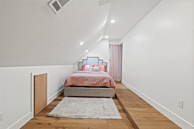 3412 Regal, Mesquite, TX 75149 - bedroom with vaulted ceiling, baseboards, recessed lighting, and light wood-style floors