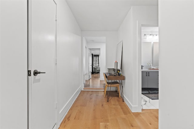 3412 Regal, Mesquite, TX 75149 - hallway with light wood-style floors, an office area, and baseboards
