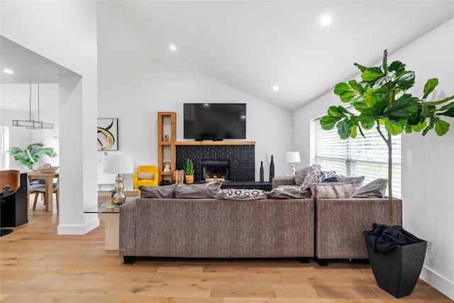 3412 Regal, Mesquite, TX 75149 - living room with high vaulted ceiling, light wood-style flooring, a fireplace, recessed lighting, and baseboards