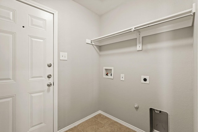 2004 Uvalde Dr, Forney, TX 75126 - washroom with hookup for a washing machine, electric dryer hookup, baseboards, light tile patterned floors, and hookup for a gas dryer