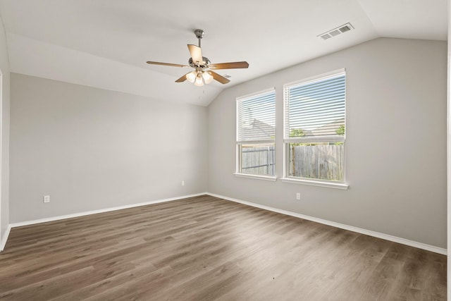 2004 Uvalde Dr, Forney, TX 75126 - spare room with vaulted ceiling, ceiling fan, wood finished floors, and baseboards