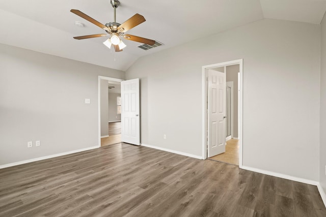2004 Uvalde Dr, Forney, TX 75126 - unfurnished bedroom with vaulted ceiling, wood finished floors, baseboards, and ceiling fan