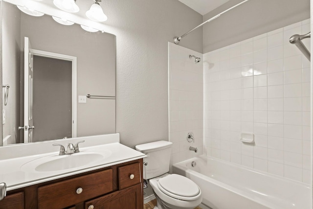 2004 Uvalde Dr, Forney, TX 75126 - full bathroom with vanity,  shower combination, toilet, and a textured wall