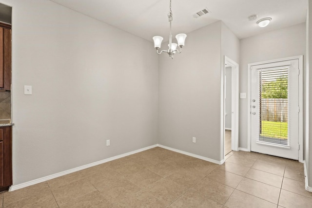 2004 Uvalde Dr, Forney, TX 75126 - unfurnished dining area featuring a chandelier, light tile patterned flooring, and baseboards
