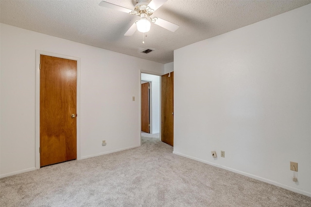 6417 Winifred Dr, Fort Worth, TX 76133 - empty room with light carpet, a textured ceiling, and a ceiling fan