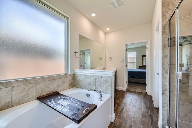 1217 Burlingame Dr, Cleburne, TX 76033 - ensuite bathroom featuring a bath, a shower stall, wood finished floors, vanity, and recessed lighting