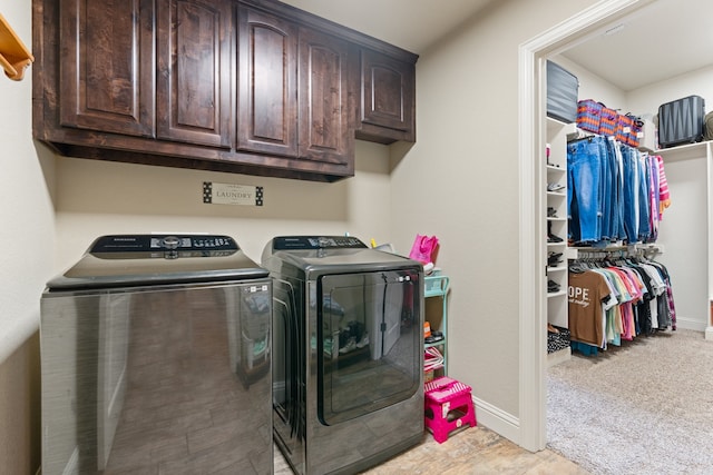 906 Joshua Ct, Granbury, TX 76048 - laundry area with washer and clothes dryer, cabinet space, and baseboards
