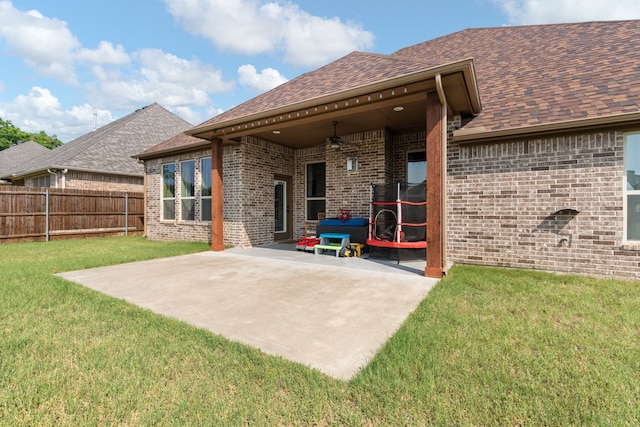 906 Joshua Ct, Granbury, TX 76048 - rear view of house with a patio, brick siding, a shingled roof, and a ceiling fan