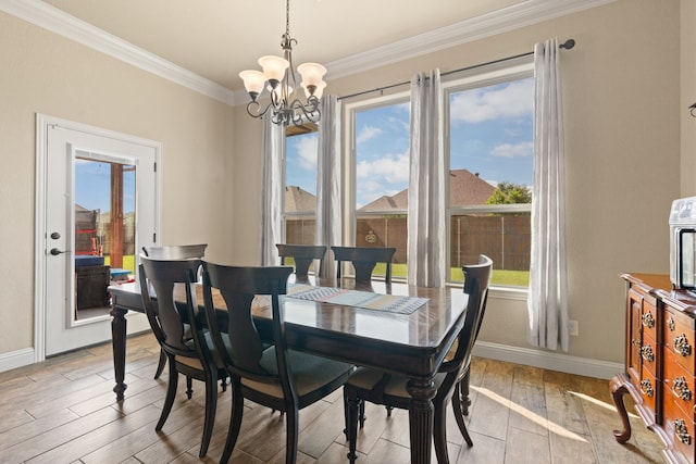906 Joshua Ct, Granbury, TX 76048 - dining room featuring a chandelier, baseboards, light wood finished floors, crown molding, and healthy amount of natural light