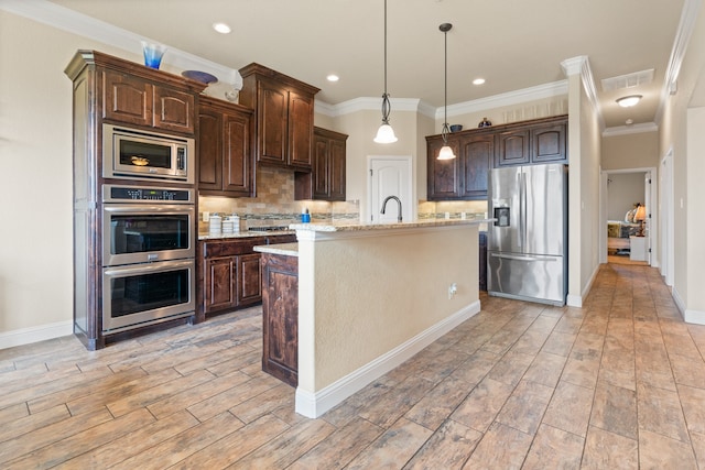 906 Joshua Ct, Granbury, TX 76048 - kitchen with appliances with stainless steel finishes, backsplash, dark brown cabinetry, light wood-type flooring, and crown molding