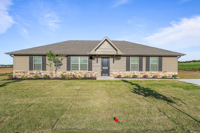 3821 Pine Rd, Poolville, TX 76487 - ranch-style house with a front yard, a shingled roof, and stone siding