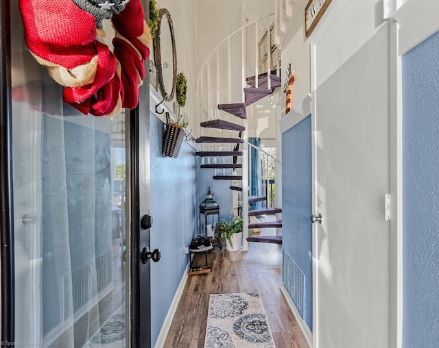 1006 Signal Ridge Pl, Rockwall, TX 75032 - entryway featuring wood finished floors, a textured wall, stairs, and baseboards