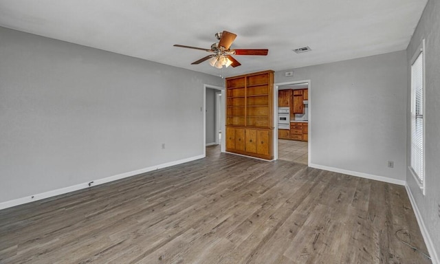 3732 N 24th St, Waco, TX 76708 - unfurnished bedroom with wood finished floors, baseboards, and ceiling fan