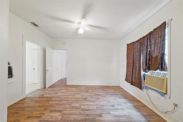 2610 Columbus Ave, Fort Worth, TX 76164 - empty room with wood finished floors, a ceiling fan, and baseboards