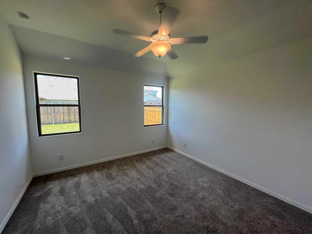 805 Roanoke, Princeton, TX 75407 - unfurnished room with dark colored carpet, ceiling fan, baseboards, and a smoke detector