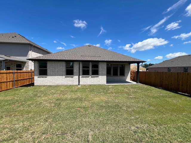 805 Roanoke, Princeton, TX 75407 - rear view of house with brick siding, a patio area, and roof with shingles