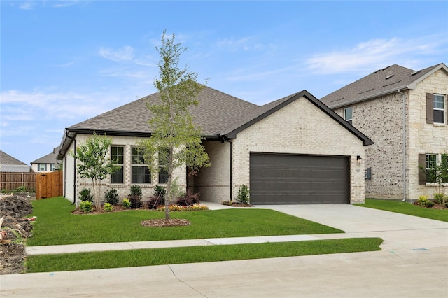 805 Roanoke, Princeton, TX 75407 - french country style house featuring an attached garage, roof with shingles, driveway, and brick siding