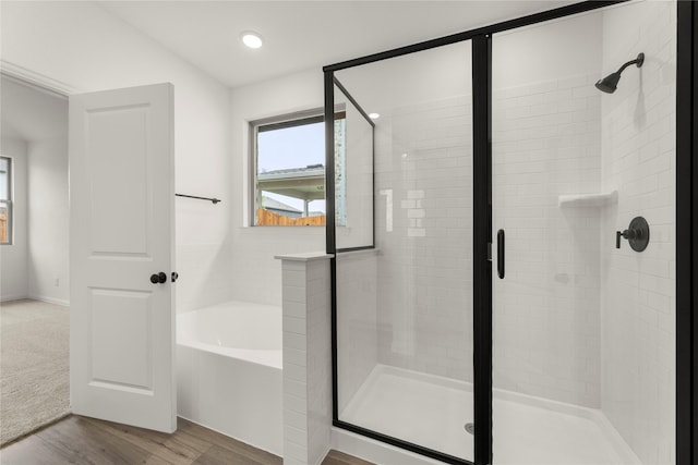 805 Roanoke, Princeton, TX 75407 - full bath with a stall shower, a bath, wood finished floors, and recessed lighting