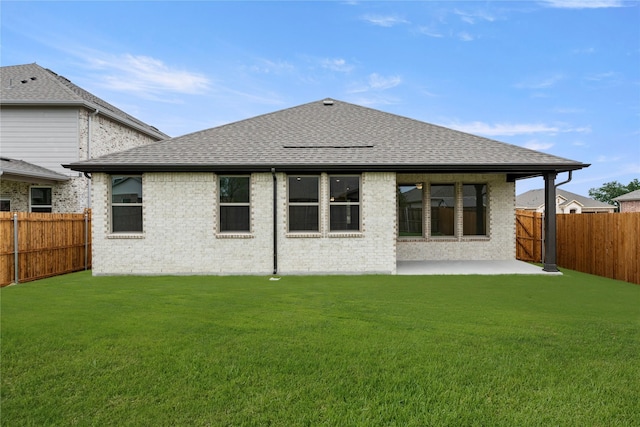 805 Roanoke, Princeton, TX 75407 - back of property with a fenced backyard, a patio area, and a shingled roof