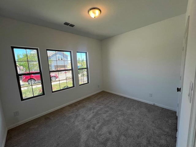 805 Roanoke, Princeton, TX 75407 - spare room with dark colored carpet and baseboards