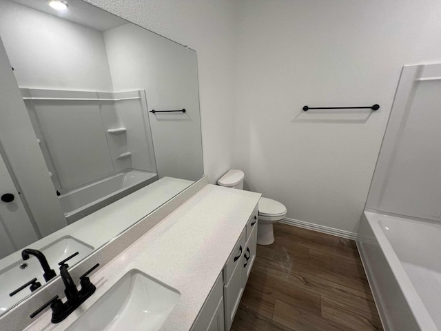 805 Roanoke, Princeton, TX 75407 - full bath featuring wood finished floors, toilet, double vanity, baseboards, and bathing tub / shower combination