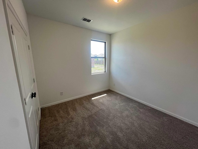 805 Roanoke, Princeton, TX 75407 - unfurnished bedroom with dark carpet and baseboards