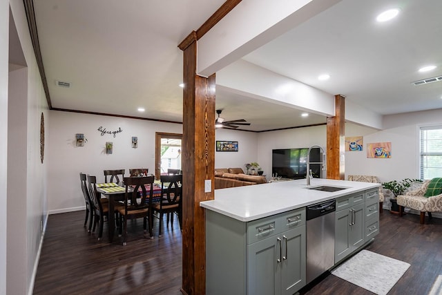 1019 Patricia Dr, Sherman, TX 75090 - kitchen with stainless steel dishwasher, open floor plan, gray cabinets, light countertops, and dark wood-style floors