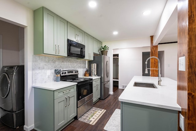 1019 Patricia Dr, Sherman, TX 75090 - kitchen with stainless steel appliances, a sink, green cabinets, washer / dryer, and recessed lighting