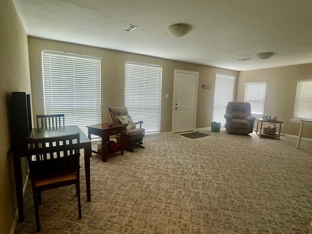 218 Wight St, Roxton, TX 75477 - living area featuring baseboards and carpet flooring