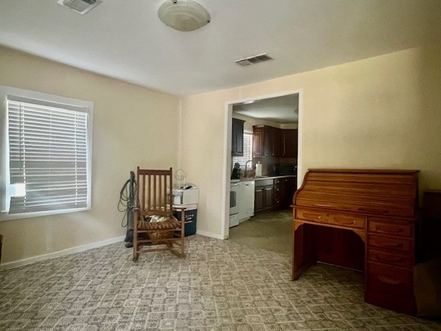 218 Wight St, Roxton, TX 75477 - living area with baseboards and light colored carpet