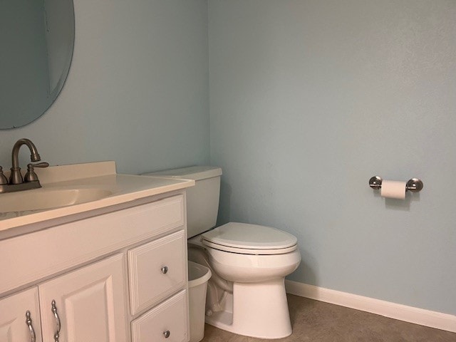 218 Wight St, Roxton, TX 75477 - half bath featuring toilet, vanity, and baseboards