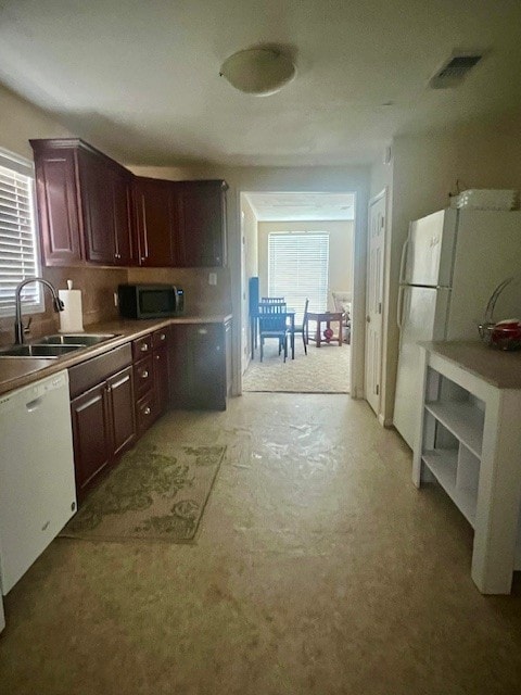 218 Wight St, Roxton, TX 75477 - kitchen featuring a sink and white appliances
