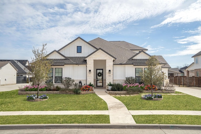 124 Craigmore Dr, Argyle, TX 76226 - view of front of property featuring board and batten siding, a shingled roof, and stone siding