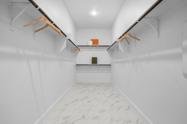 124 Craigmore Dr, Argyle, TX 76226 - walk in closet featuring marble look tile flooring