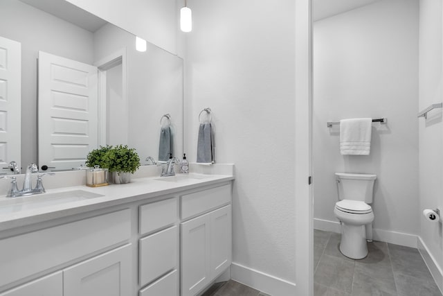 124 Craigmore Dr, Argyle, TX 76226 - bathroom featuring double vanity, baseboards, toilet, and tile patterned flooring